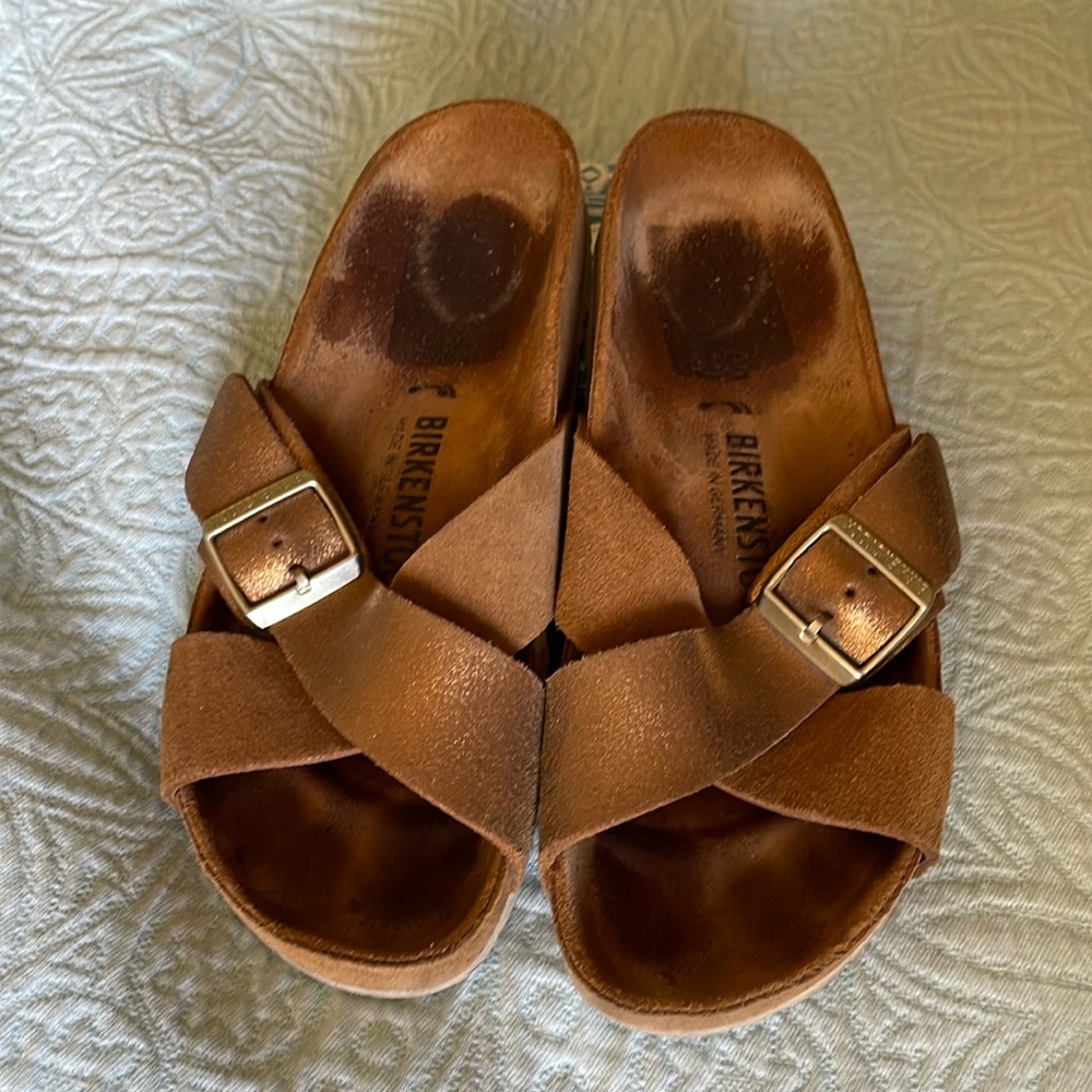Gently used Birkenstock sandals. Metallic leather.